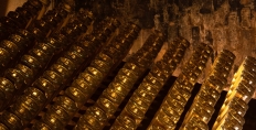 Champagne bottles in a riddling rack